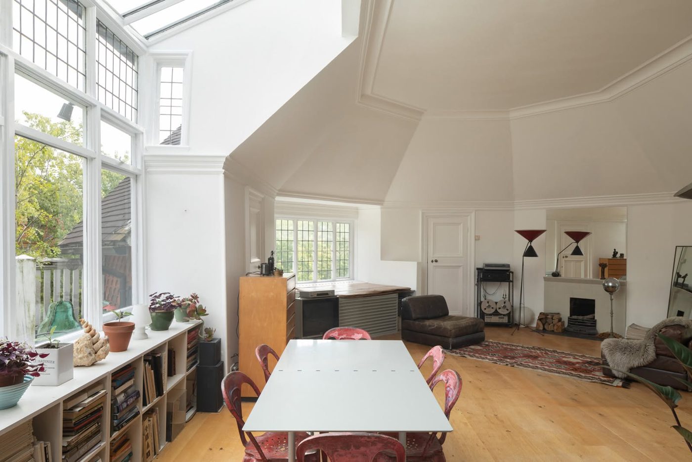 Open-plan reception room with vaulted ceiling, fully redecorated